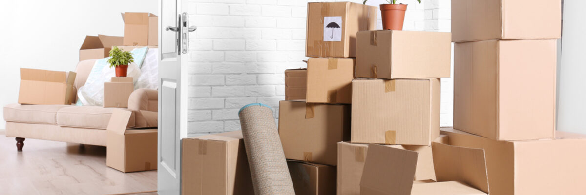 A pile of boxes in an empty room